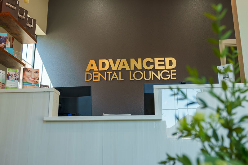 The front desk and lounge at Advanced Dental Lounge & Implants