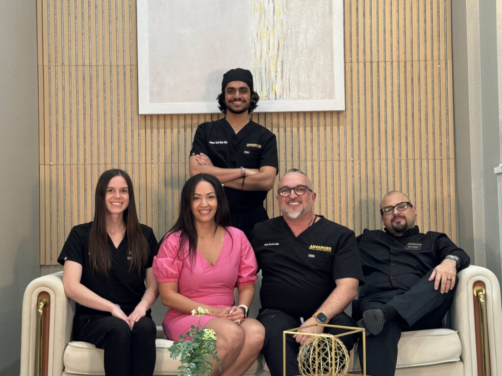 The Advanced Dental Lounge & Implants team together in the office lounge
